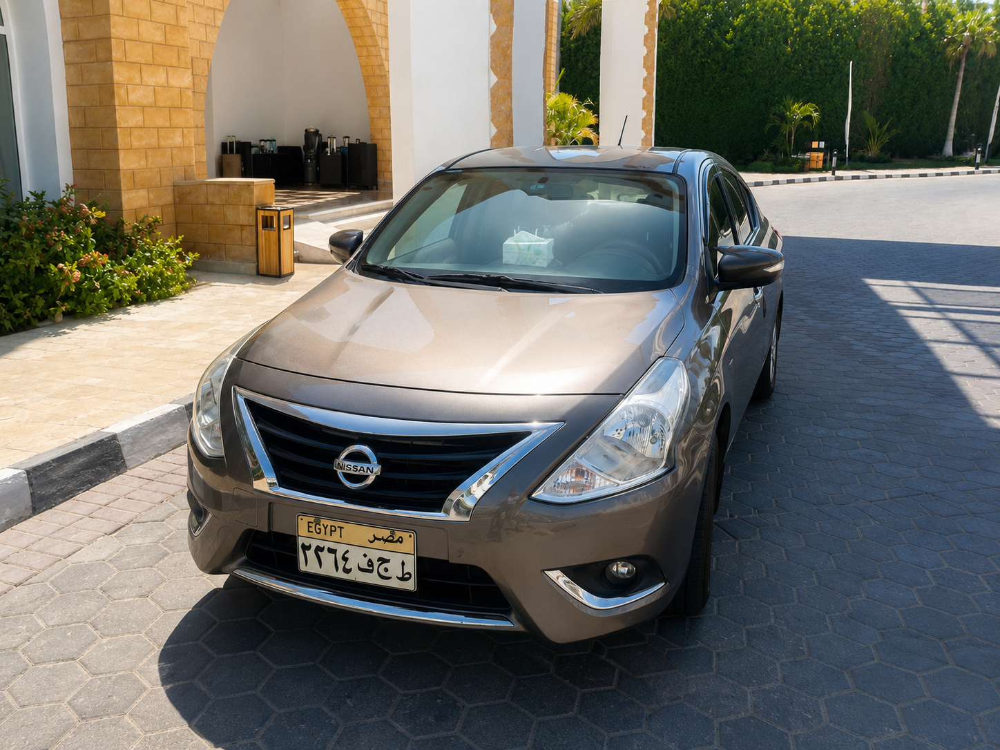 Nissan Sunny sedan parked at a resort entrance in South Sinai