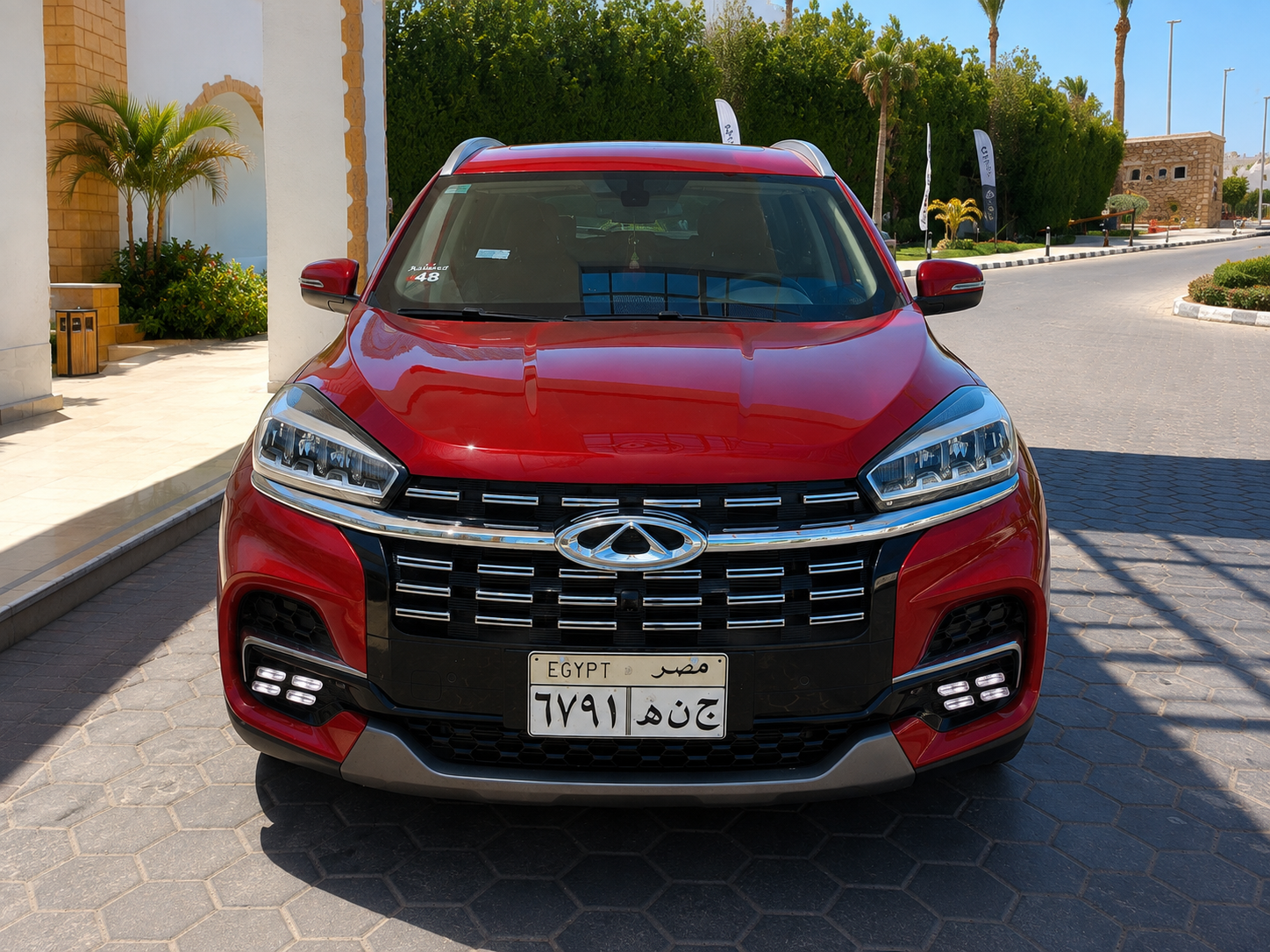 Our Chery Tiggo 8 SUV parked at a South Sinai resort entrance, ready for guest transfers